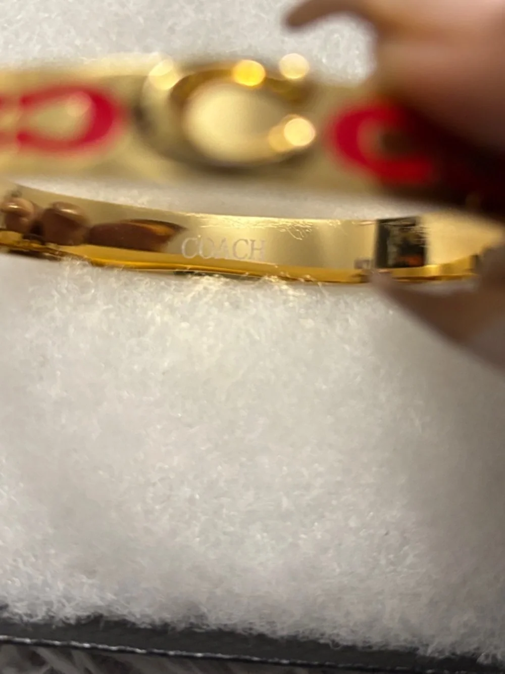 Coach Gold-Tone Cuff Bracelet with Red Signature Motif